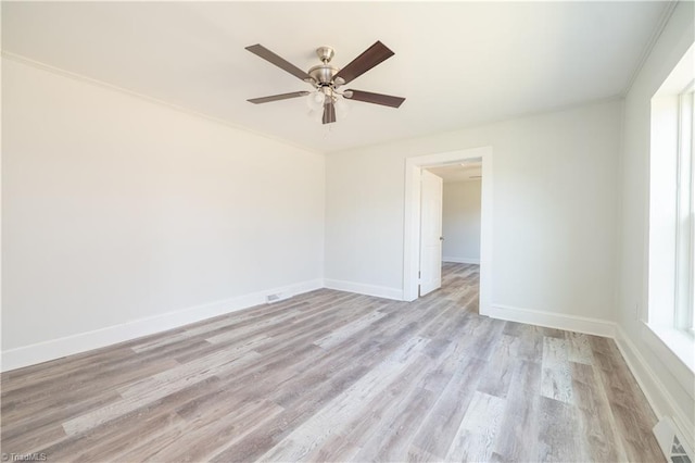 1473 Briarcliff Dr, Asheboro, NC 27205 - unfurnished room with a healthy amount of sunlight, baseboards, visible vents, light wood-style flooring, and ceiling fan