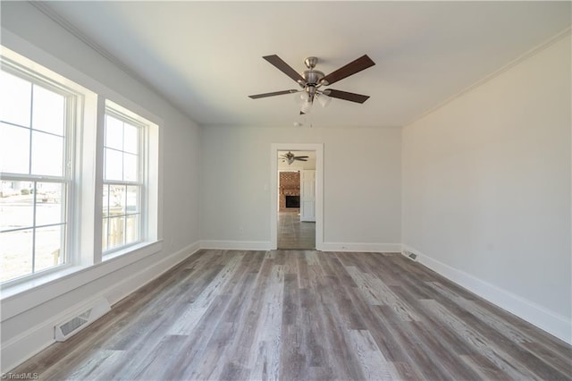 1473 Briarcliff Dr, Asheboro, NC 27205 - empty room with wood finished floors, a ceiling fan, visible vents, and baseboards