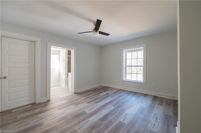 1473 Briarcliff Dr, Asheboro, NC 27205 - spare room featuring a ceiling fan, wood finished floors, visible vents, and baseboards