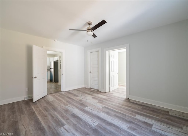 1473 Briarcliff Dr, Asheboro, NC 27205 - unfurnished bedroom featuring freestanding refrigerator, baseboards, and wood finished floors