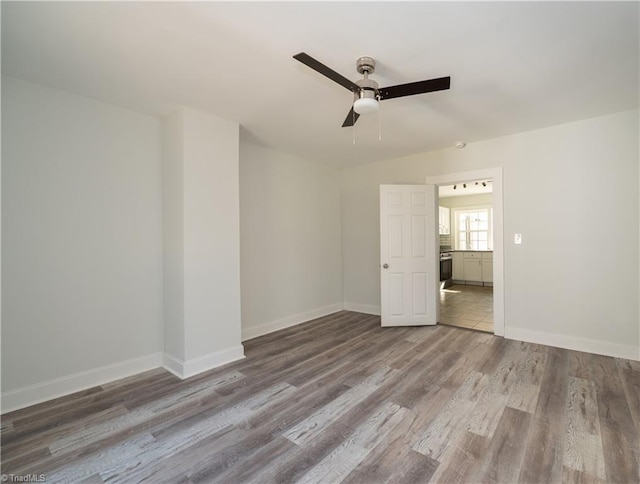 1473 Briarcliff Dr, Asheboro, NC 27205 - empty room featuring baseboards, wood finished floors, and a ceiling fan