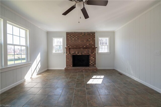 1473 Briarcliff Dr, Asheboro, NC 27205 - unfurnished living room featuring plenty of natural light, a fireplace, crown molding, and a ceiling fan
