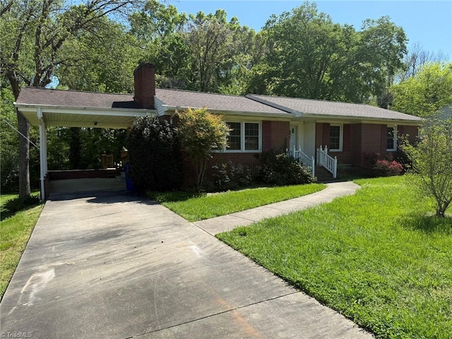615 Paris St, Graham, NC 27253 - single story home featuring concrete driveway, brick siding, a chimney, and a front lawn