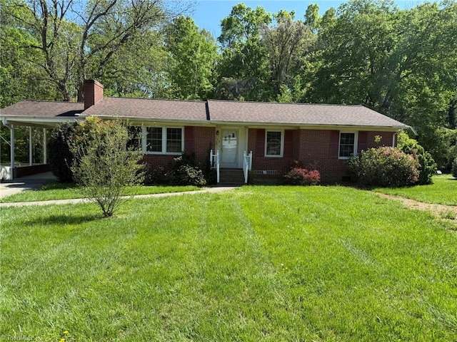 615 Paris St, Graham, NC 27253 - single story home with a carport, brick siding, a chimney, and a front lawn