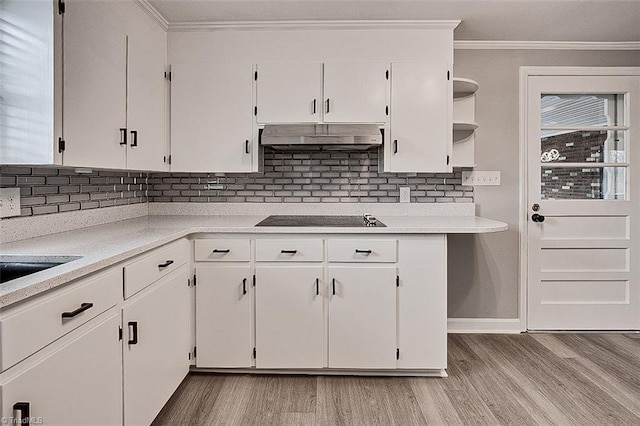 kitchen featuring extractor fan, light hardwood / wood-style flooring, black electric stovetop, white cabinetry, and ornamental molding