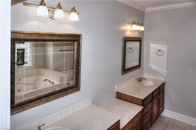 bathroom with tile patterned flooring, crown molding, baseboards, a tub with jets, and vanity