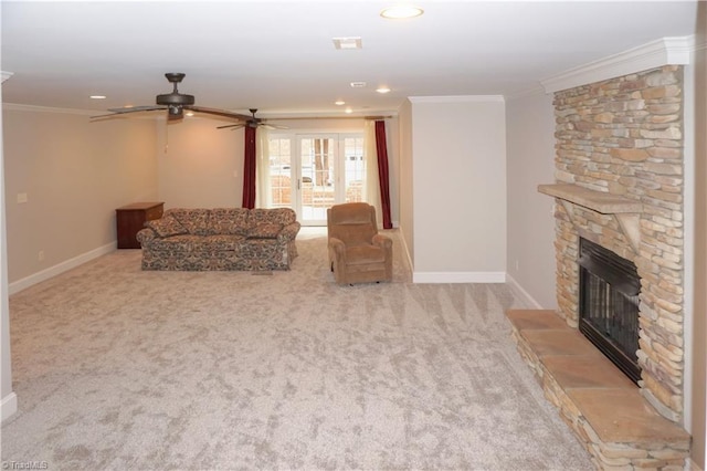 carpeted living area with recessed lighting, baseboards, ornamental molding, and a fireplace