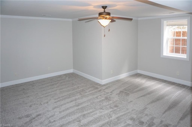 unfurnished room featuring ceiling fan, baseboards, carpet floors, and ornamental molding