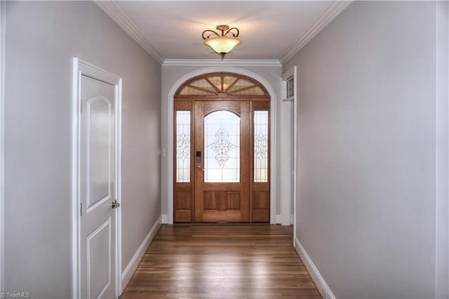 foyer entrance with baseboards, dark wood finished floors, and crown molding