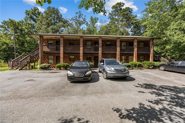 101 Bay Meadow Ct, Lexington, NC 27292 - view of building exterior with stairway and uncovered parking