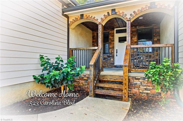 doorway to property featuring a porch