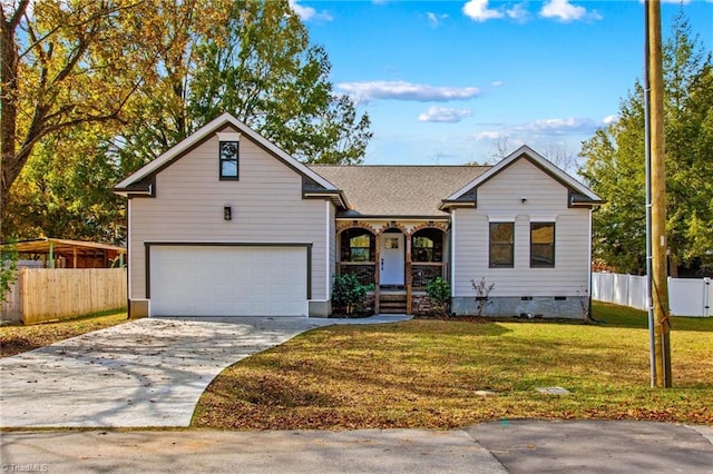 view of front of home with a garage and a front lawn