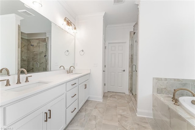 bathroom with ornamental molding, a bath, a stall shower, and a sink