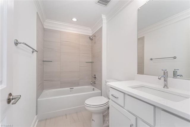 full bathroom with vanity, toilet, ornamental molding, and tiled shower / bath