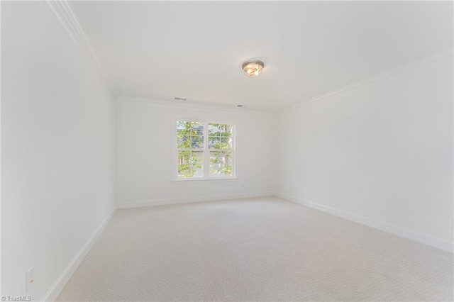 unfurnished room with light carpet, visible vents, crown molding, and baseboards
