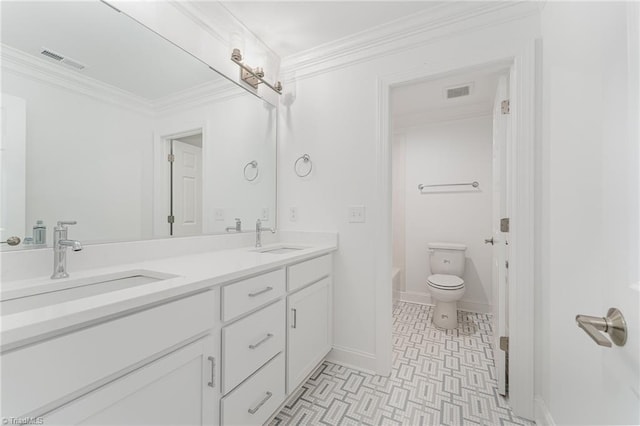 full bath with crown molding, visible vents, and a sink