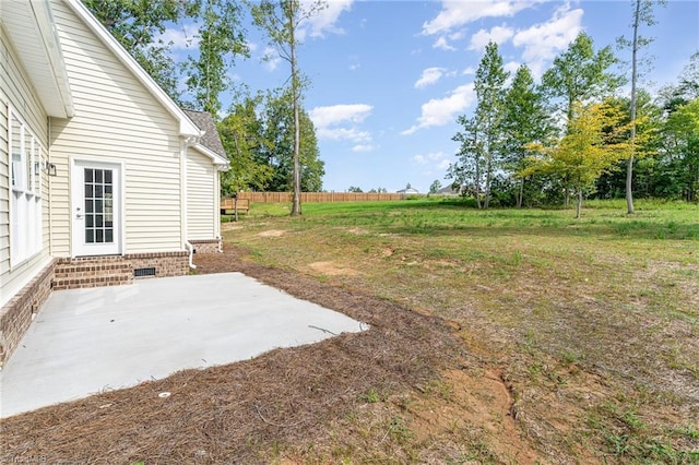 view of yard with entry steps, a patio, and fence