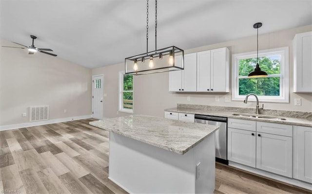 3077 Little Creek Dr, Thomasville, NC 27360 - kitchen with dishwasher, a center island, white cabinetry, and ceiling fan