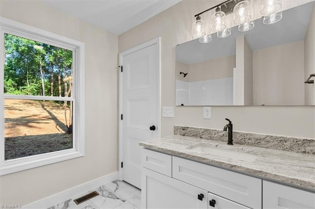 3077 Little Creek Dr, Thomasville, NC 27360 - full bathroom featuring vanity, marble look tiles, and a shower