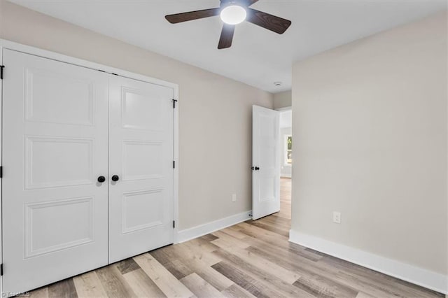 3077 Little Creek Dr, Thomasville, NC 27360 - unfurnished bedroom featuring light wood-style floors, a closet, and a ceiling fan