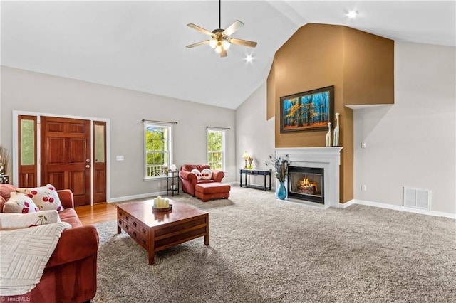 159 Forest Abbey Ln, China Grove, NC 28023 - carpeted living area featuring ceiling fan, high vaulted ceiling, and a fireplace with flush hearth