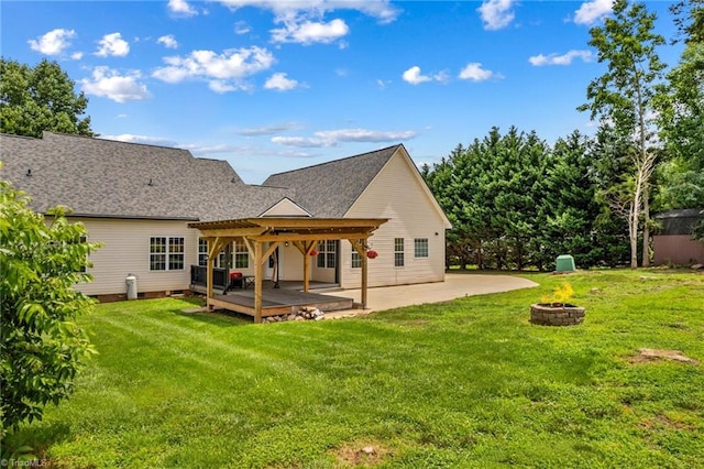 159 Forest Abbey Ln, China Grove, NC 28023 - rear view of house featuring an outdoor fire pit, a lawn, and a patio area