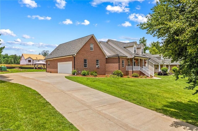 159 Forest Abbey Ln, China Grove, NC 28023 - view of front of home with brick siding, a garage, covered porch, a front yard, and driveway