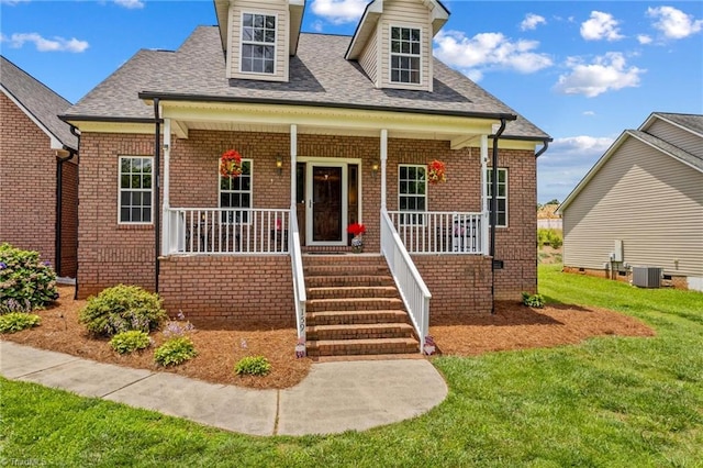 159 Forest Abbey Ln, China Grove, NC 28023 - view of front of property with a porch, a front yard, a shingled roof, and brick siding