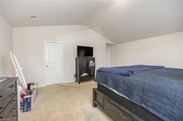 carpeted bedroom featuring vaulted ceiling