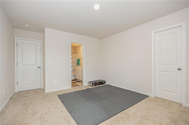 workout room featuring light colored carpet