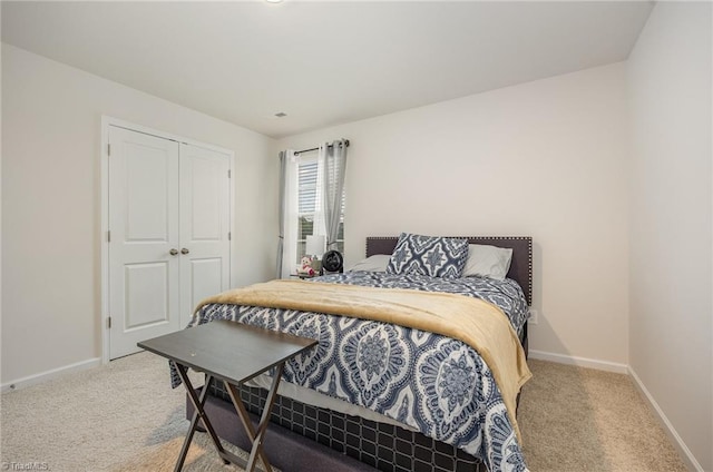 bedroom featuring a closet and carpet floors