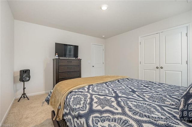 bedroom featuring a closet and carpet