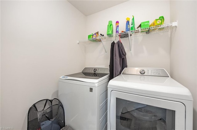 washroom featuring washing machine and dryer