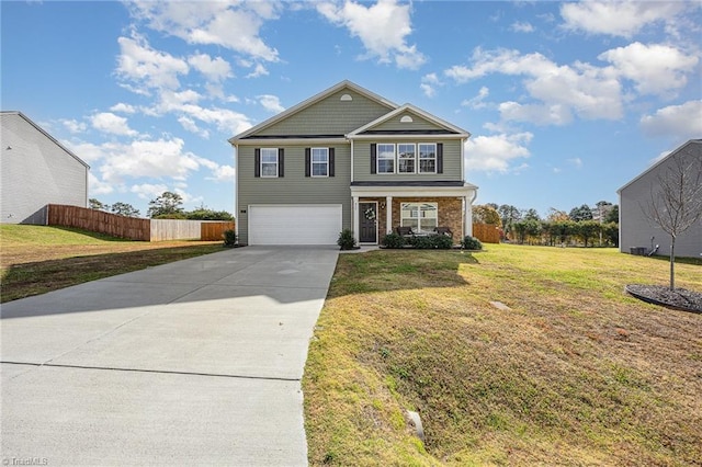 view of property with a garage and a front lawn