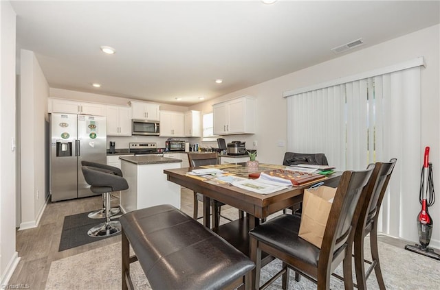 dining room featuring light hardwood / wood-style floors