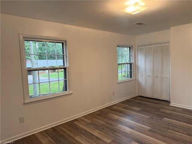 1427 Westwood Ln, Wilkesboro, NC 28697 - unfurnished bedroom with baseboards, dark wood-style flooring, and a closet