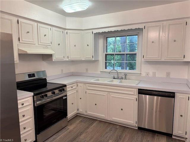 1427 Westwood Ln, Wilkesboro, NC 28697 - kitchen with stainless steel appliances, under cabinet range hood, a sink, and light countertops