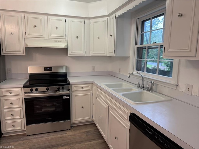 1427 Westwood Ln, Wilkesboro, NC 28697 - kitchen with appliances with stainless steel finishes, under cabinet range hood, a sink, and light countertops