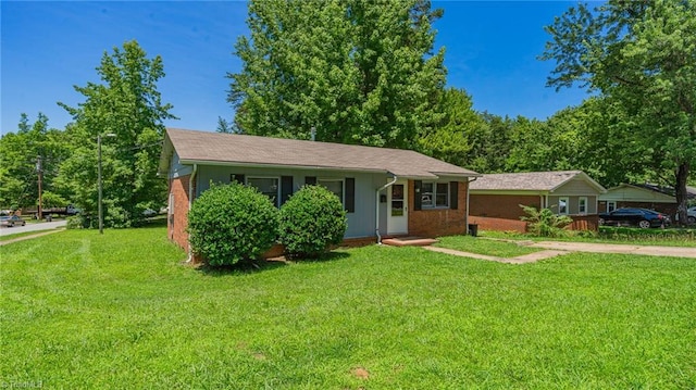 157 Blaze St, Winston-Salem, NC 27105 - ranch-style home with a front yard and brick siding