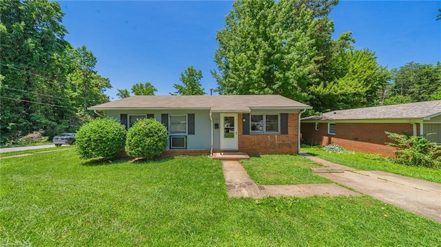 157 Blaze St, Winston-Salem, NC 27105 - view of front of property with a front lawn and brick siding