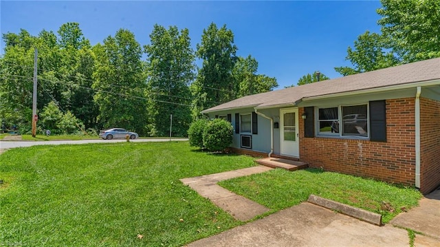 157 Blaze St, Winston-Salem, NC 27105 - view of front facade with a front yard and brick siding