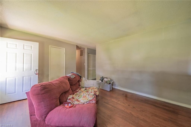 157 Blaze St, Winston-Salem, NC 27105 - living area featuring wood finished floors and a textured ceiling