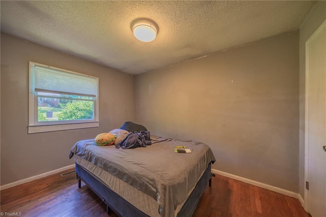 157 Blaze St, Winston-Salem, NC 27105 - bedroom featuring wood finished floors and a textured ceiling