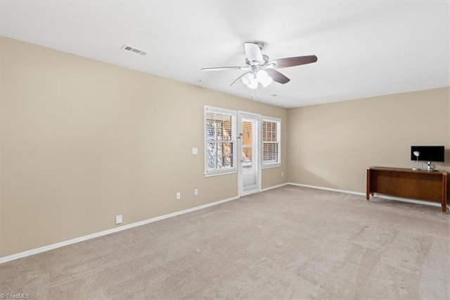 interior space with ceiling fan