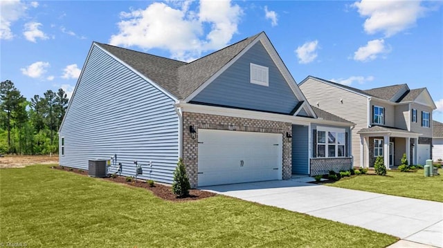 view of front of house with a front yard and central AC