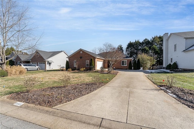 ranch-style house featuring a garage and a front lawn