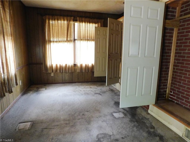 314 S Mccallum St, Candor, NC 27229 - carpeted empty room with wood walls