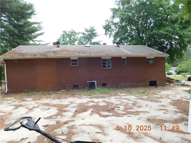 314 S Mccallum St, Candor, NC 27229 - rear view of property featuring crawl space, cooling unit, and brick siding