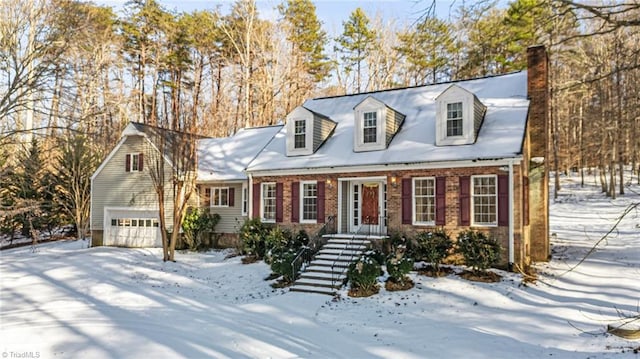 new england style home with a garage