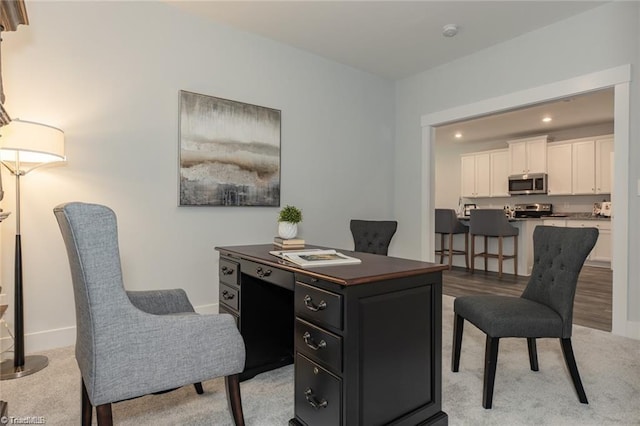 home office with recessed lighting and baseboards